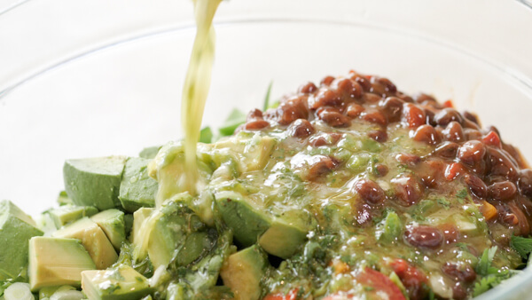 How to make Fiesta Fattoush Salad with fried flour tortillas, black beans, and homemade cilantro lime dressing. Easy weeknight dinner packed with veggies.