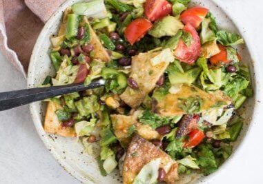 How to make Fiesta Fattoush Salad with fried flour tortillas, black beans, and homemade cilantro lime dressing. Easy weeknight dinner packed with veggies.